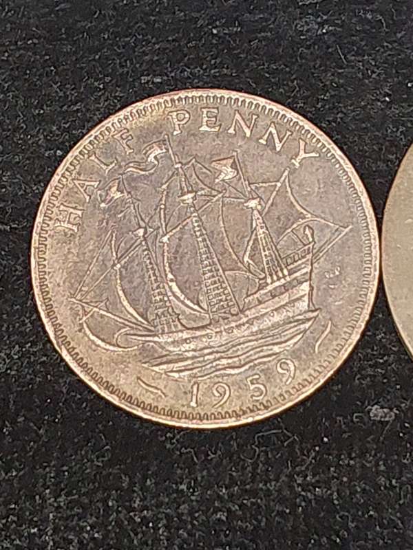 AN ANTIQUE JOBLOT COLLECTION PENNY'S AND RAILWAY TOKENS FROM BRITTAIN AND SOUTH AFRICA SOLD AS IS