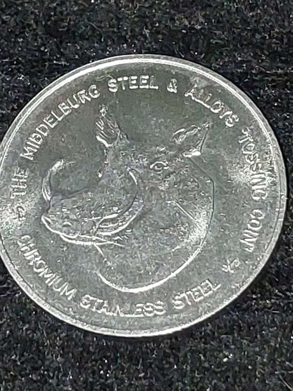 THE MIDDLEBURG STEEL AND ALLOYS WARTHOG TOSSING COIN 1990  SOLD AS IS