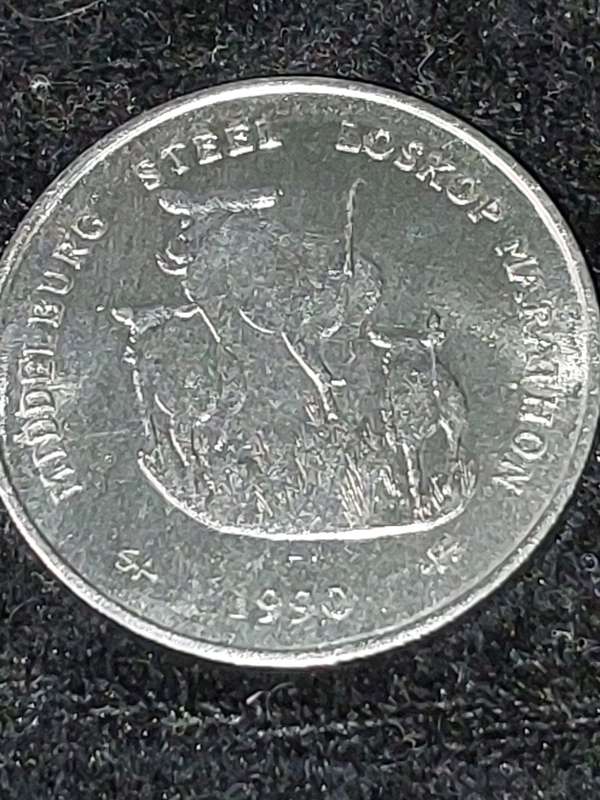 THE MIDDLEBURG STEEL AND ALLOYS WARTHOG TOSSING COIN 1990  SOLD AS IS