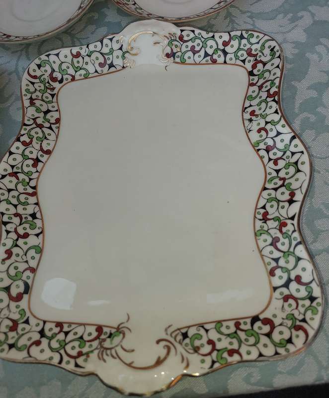 A COLLECTION OF FIVE BISTOL ENGLAND SERVING WARE TWO PLATTERS AND 3 SAUCERS , THE PLATTERS ARE 26X2