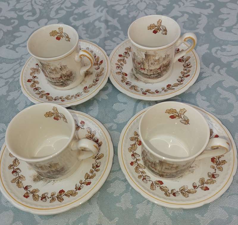 A SET OF FOUR COFFEE CUPS WITH SAUCERS BY SWINNERTON STEFFORDSHIRE ENGLAND MAJESTIC VELLUM REG NO83