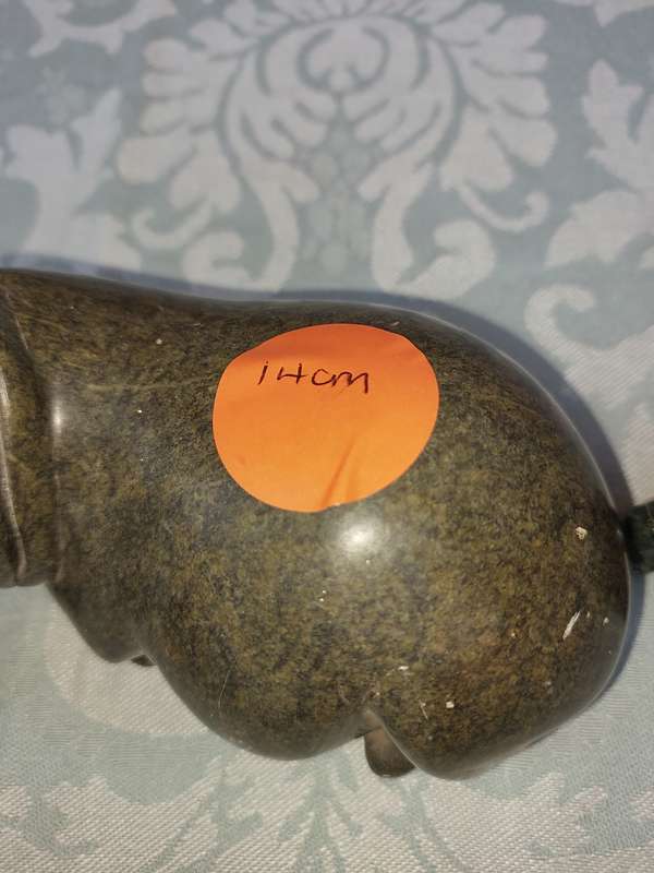 A COLLECTION OF AFRICAN HUNTER AND ANIMAL SCULPTURES SOLD AS IS