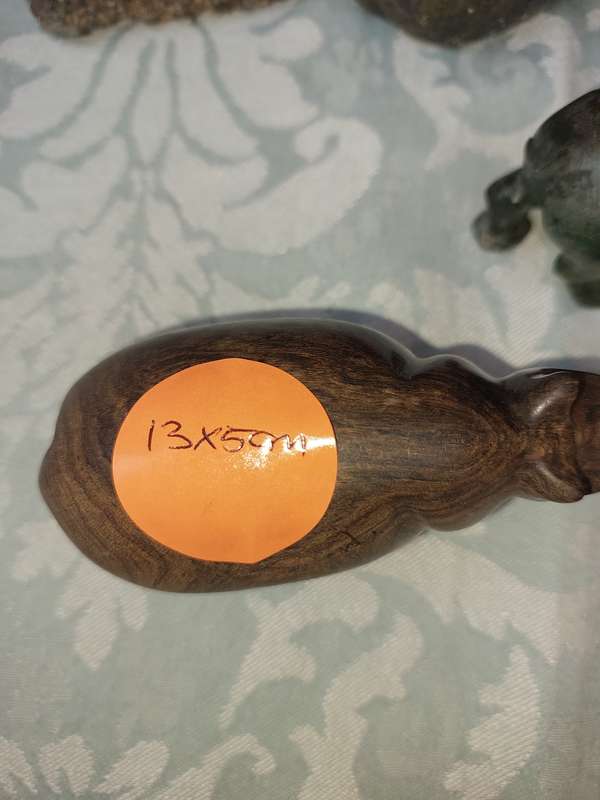 A COLLECTION OF AFRICAN HUNTER AND ANIMAL SCULPTURES SOLD AS IS