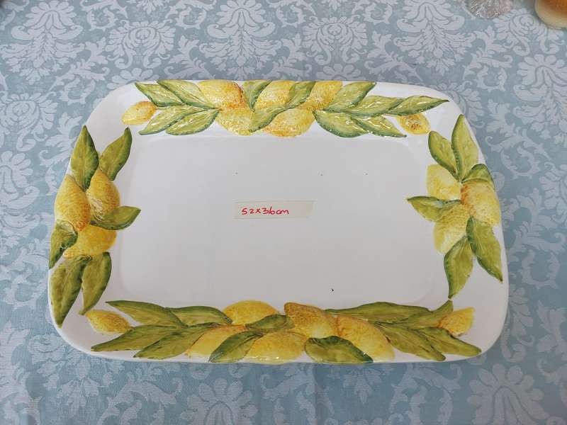A VINTAGE LEMON PLATTER MADE IN ITALY SOLD AS IS WITH A SMALL CHIP ON THE BASE