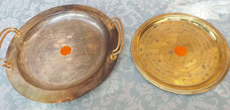 TWO VINTAGE ROUND SERVING TRAYS SOLD AS IS