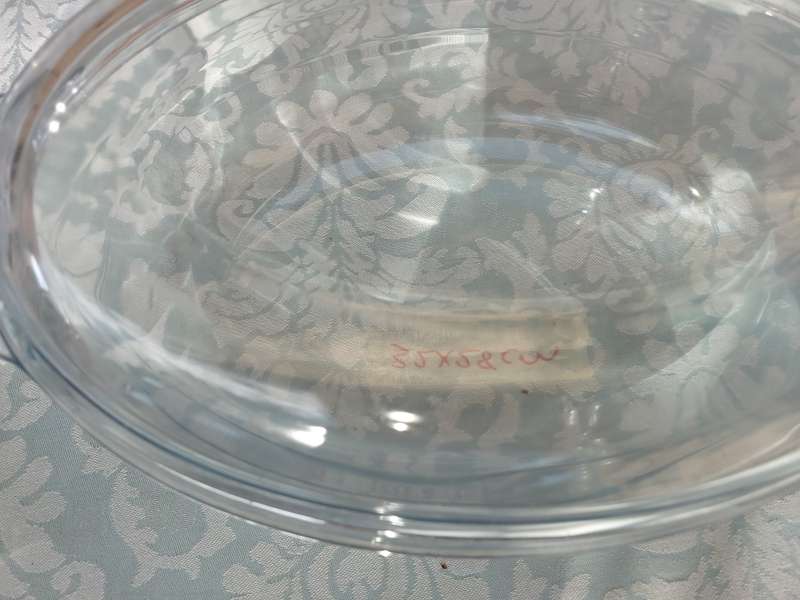 A COLLECTION OF OVEN PROOF CASEROLES SOLD AS IS