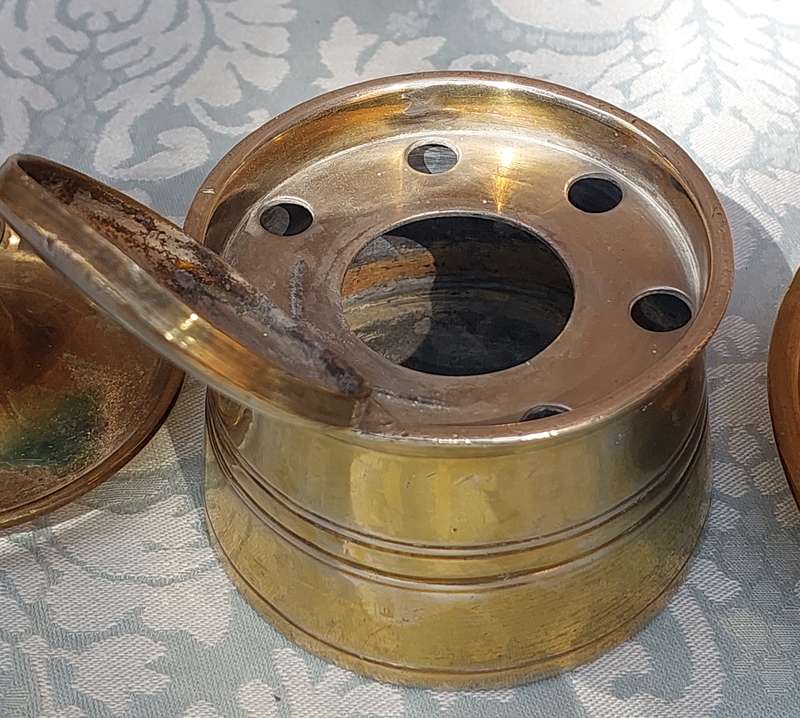 A COLLECTION OF BRASS CANDLE HOLDERS AND A DEFUSER SOLD AS IS