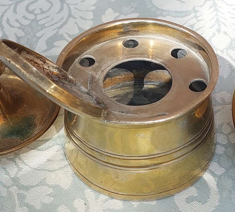A COLLECTION OF BRASS CANDLE HOLDERS AND A DEFUSER SOLD AS IS