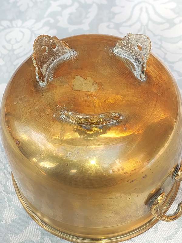 A VINTAGE BRASS FOOTED POTPLANT HOLDER SOLD AS IS R200