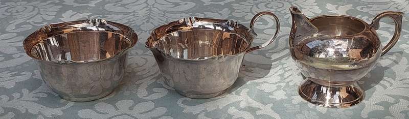 A COLLECTION OF KITCHEN UTENSILS SILVER PLATED SOLD AS IS