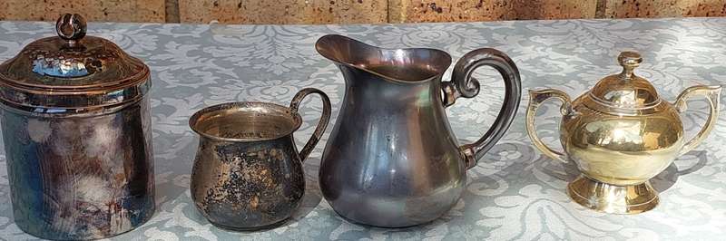 A COLLECTION OF SILVER PLATED KITCHEN UTENSILS SOLD AS IS