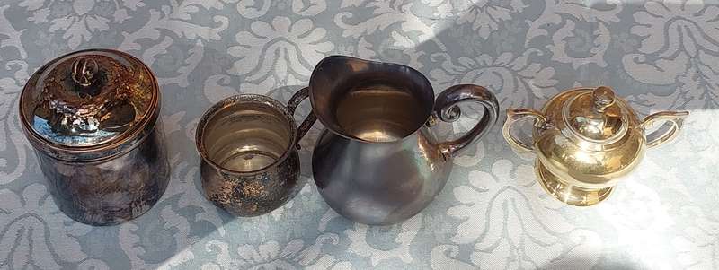 A COLLECTION OF SILVER PLATED KITCHEN UTENSILS SOLD AS IS