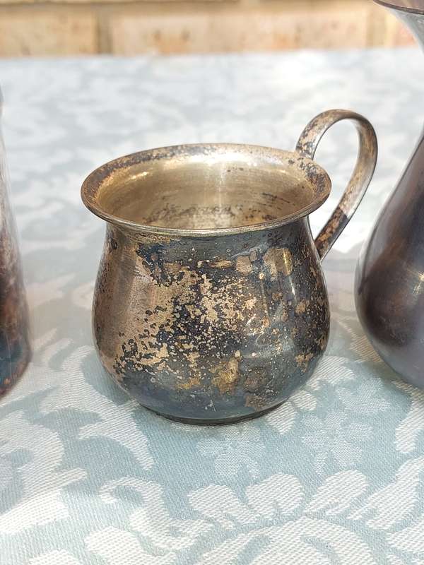A COLLECTION OF SILVER PLATED KITCHEN UTENSILS SOLD AS IS