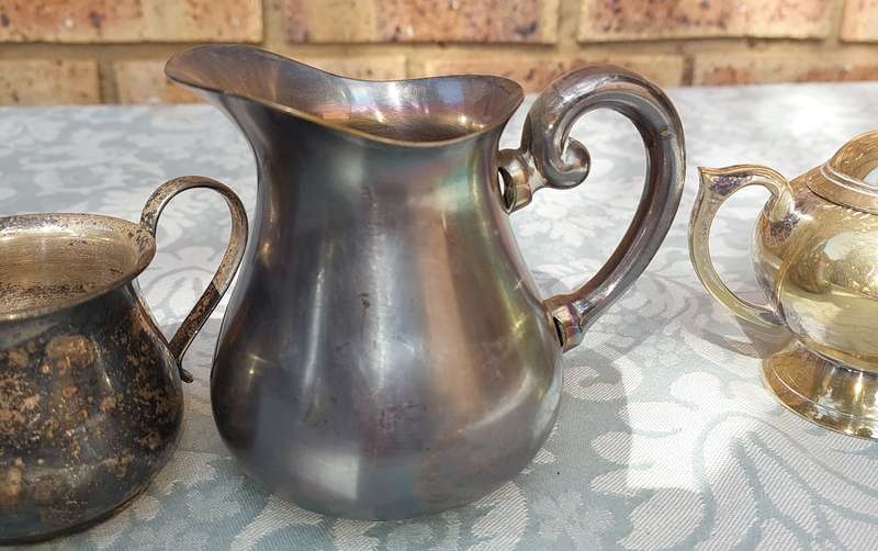 A COLLECTION OF SILVER PLATED KITCHEN UTENSILS SOLD AS IS