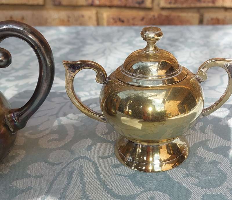A COLLECTION OF SILVER PLATED KITCHEN UTENSILS SOLD AS IS