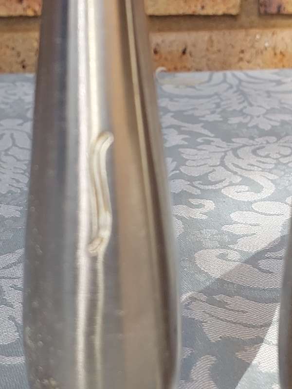A PAIR OF STAINLESS STEEL SALT N PEPPER SHAKERS SOLD AS IS