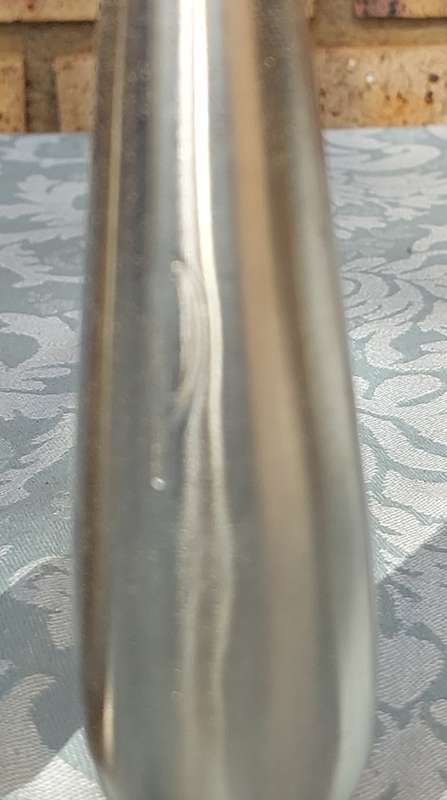 A PAIR OF STAINLESS STEEL SALT N PEPPER SHAKERS SOLD AS IS