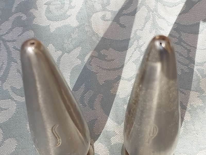 A PAIR OF STAINLESS STEEL SALT N PEPPER SHAKERS SOLD AS IS