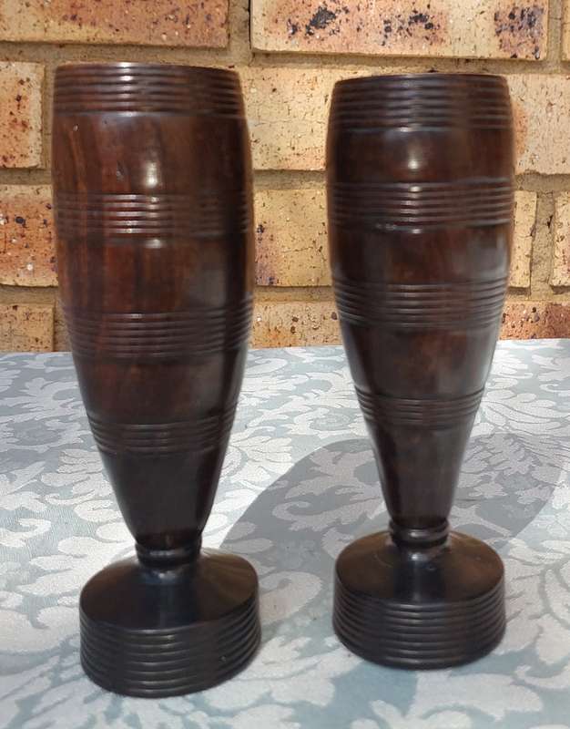 A PAIR OF WOODEN VASES SOLD AS IS R100