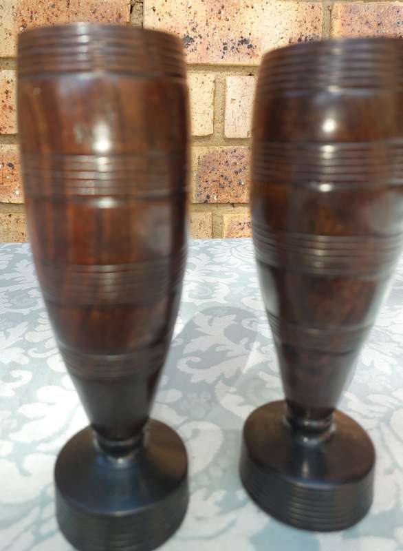 A PAIR OF WOODEN VASES SOLD AS IS R100