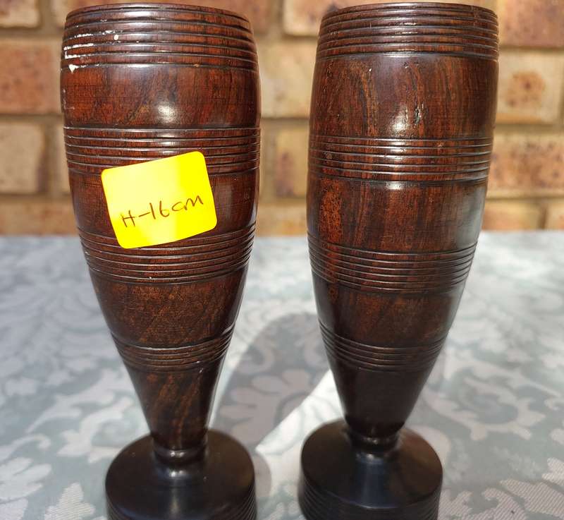 A PAIR OF WOODEN VASES SOLD AS IS R100