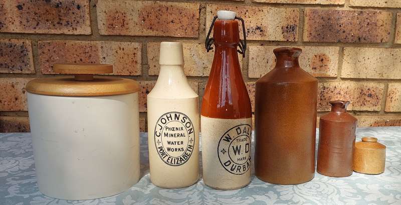 A COLLECTION OF ART DECOR STONE WARE STORAGE CONTAINERS SOLD AS IS R350
