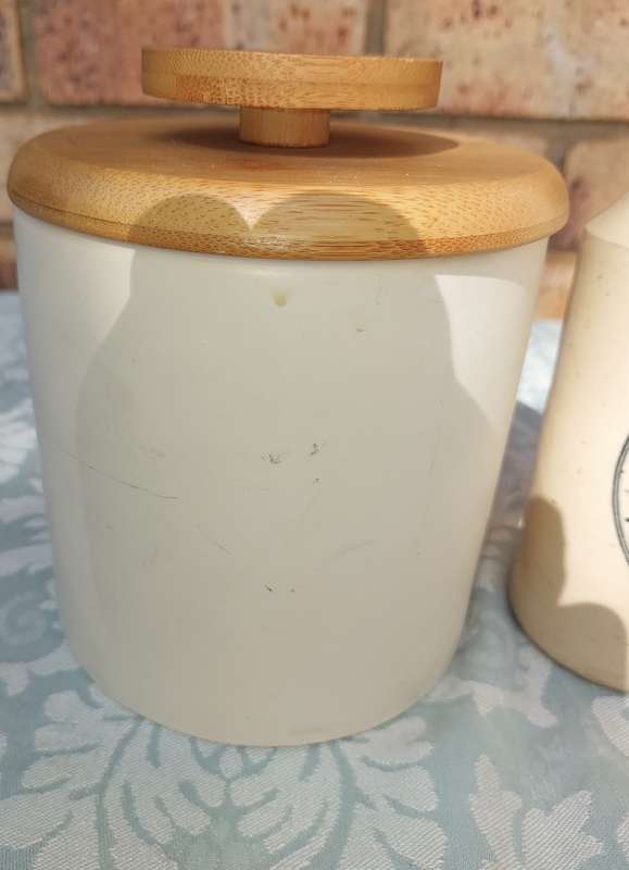 A COLLECTION OF ART DECOR STONE WARE STORAGE CONTAINERS SOLD AS IS R350