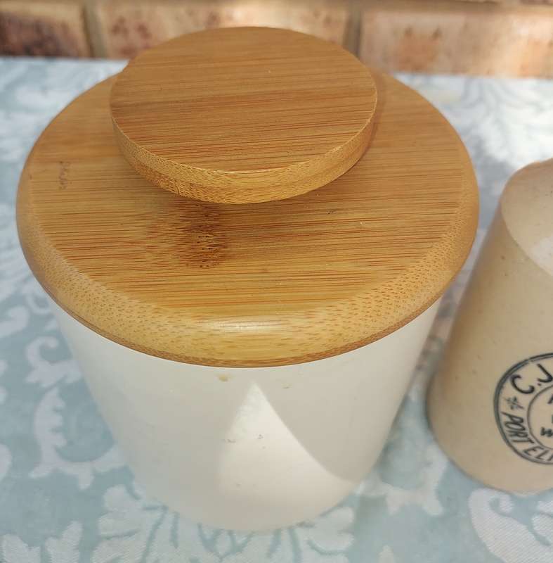 A COLLECTION OF ART DECOR STONE WARE STORAGE CONTAINERS SOLD AS IS R350