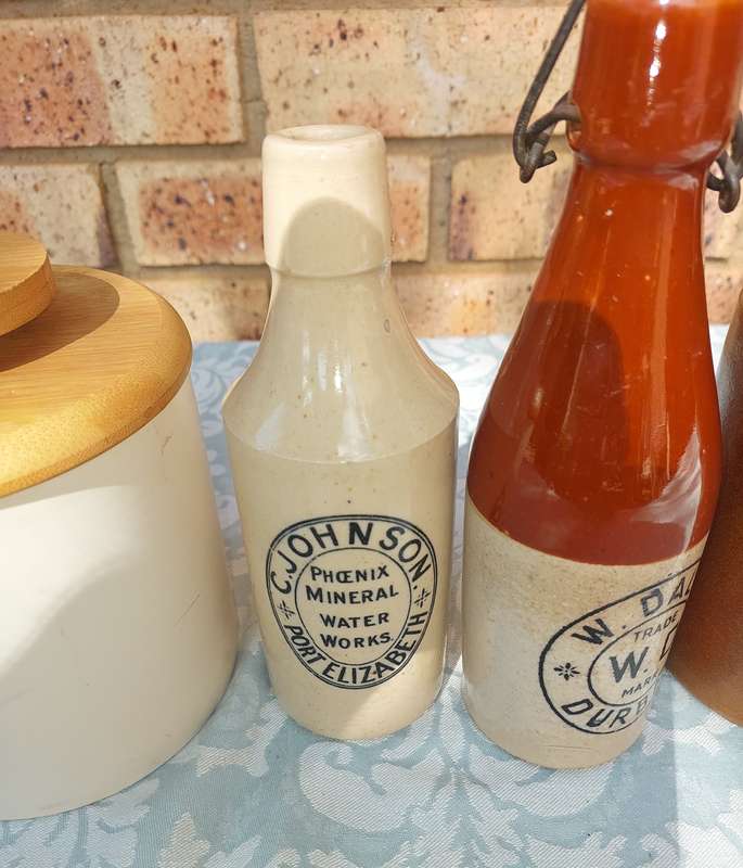 A COLLECTION OF ART DECOR STONE WARE STORAGE CONTAINERS SOLD AS IS R350