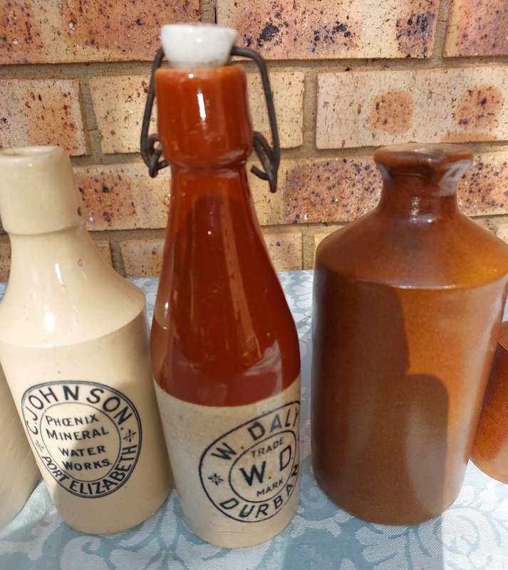 A COLLECTION OF ART DECOR STONE WARE STORAGE CONTAINERS SOLD AS IS R350