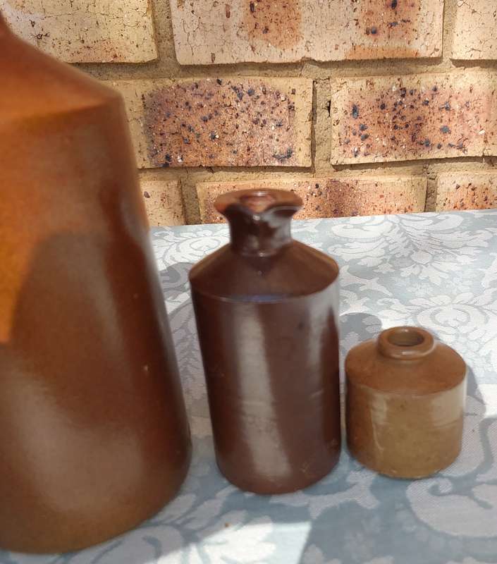 A COLLECTION OF ART DECOR STONE WARE STORAGE CONTAINERS SOLD AS IS R350