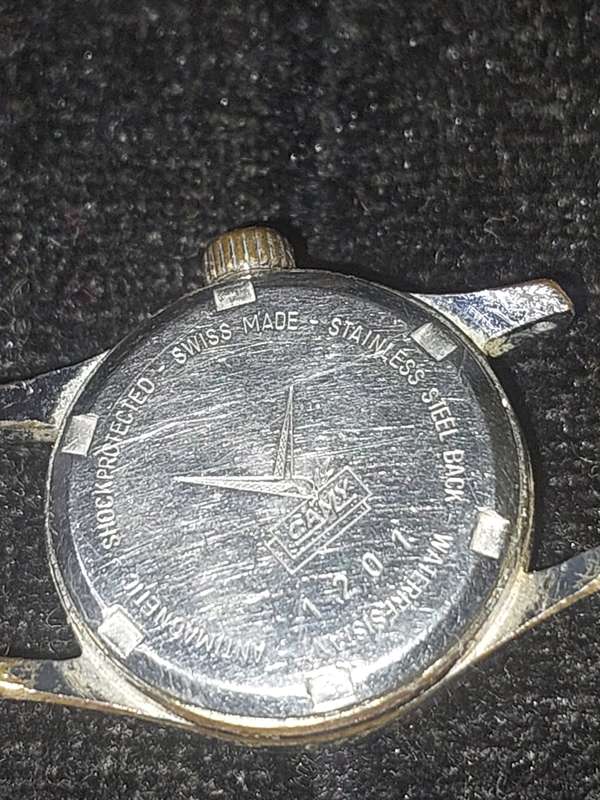 A VINTAGE CAMY 17 JEWELS SWISS MADE SERIAL NUMBER 1201 WORKING, WITH OUT A STRAP AND HAS SOME SCRATC
