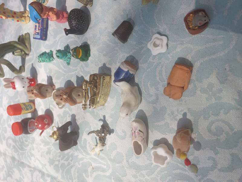 A JOB LOT COLLECTION CHARMS AND FIGURINES SOLD AS IS