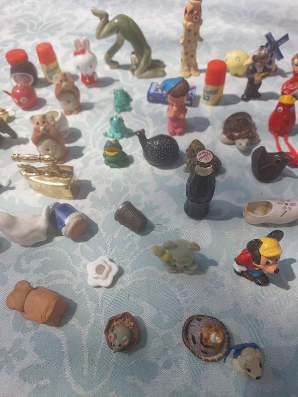 A JOB LOT COLLECTION CHARMS AND FIGURINES SOLD AS IS