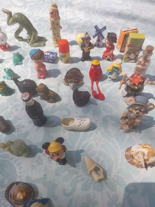 A JOB LOT COLLECTION CHARMS AND FIGURINES SOLD AS IS