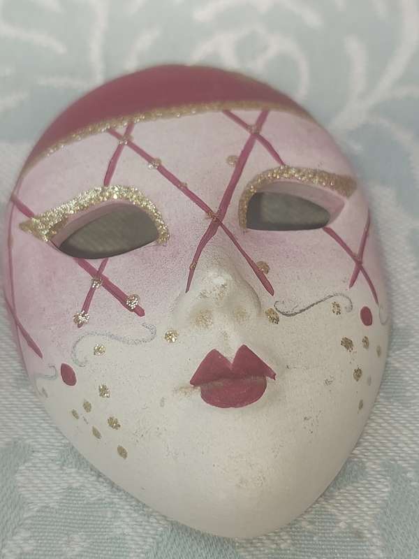 A 31 CENTIMETER PINK COLOURED CERAMIC WITH GOOD INLAY OWL STATUE