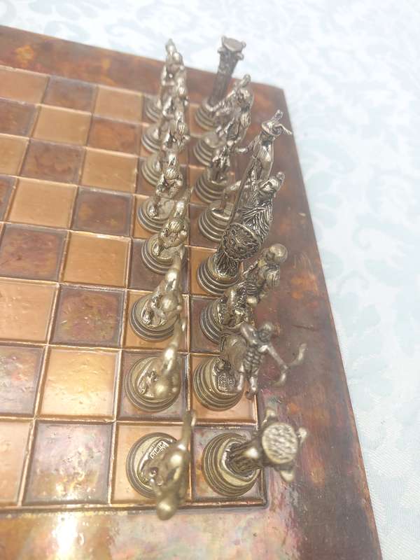 A VINTAGE COPPER AND BRONZE CHESS SET SOLD AS IS