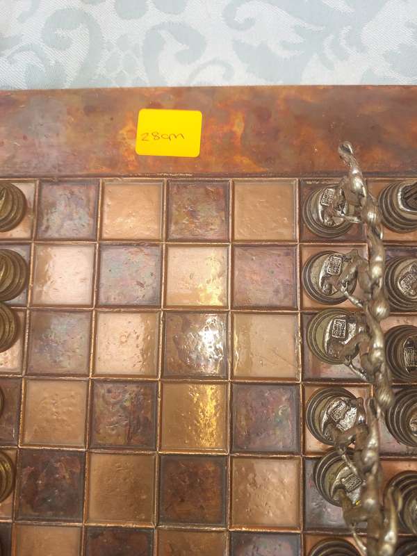 A VINTAGE COPPER AND BRONZE CHESS SET SOLD AS IS