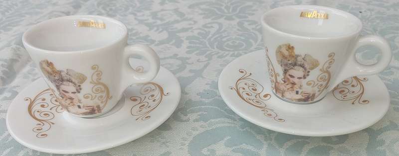 TWO COLLECTABLE LAVAZA COFFEE EXPRESSO CUPS AND SAUCERS SOLD AS IS