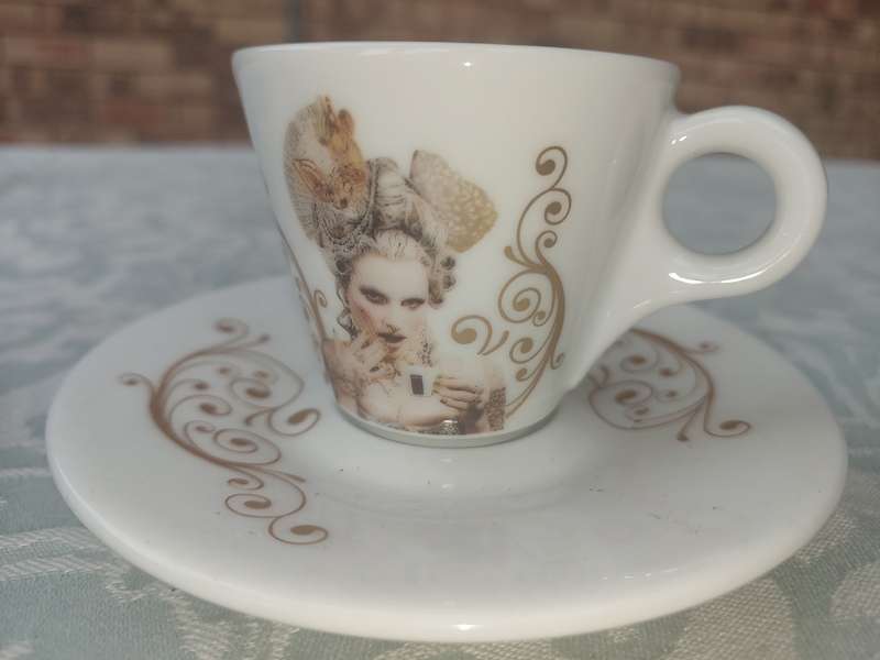 TWO COLLECTABLE LAVAZA COFFEE EXPRESSO CUPS AND SAUCERS SOLD AS IS