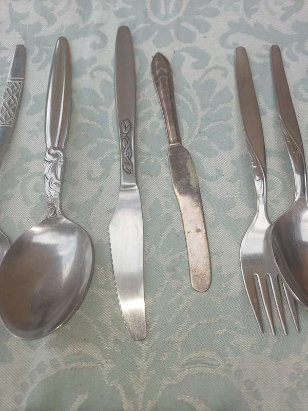 A VINTAGE JOBLOT MIXED CUTLERY SOLD AS IS