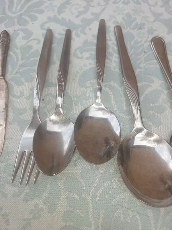 A VINTAGE JOBLOT MIXED CUTLERY SOLD AS IS