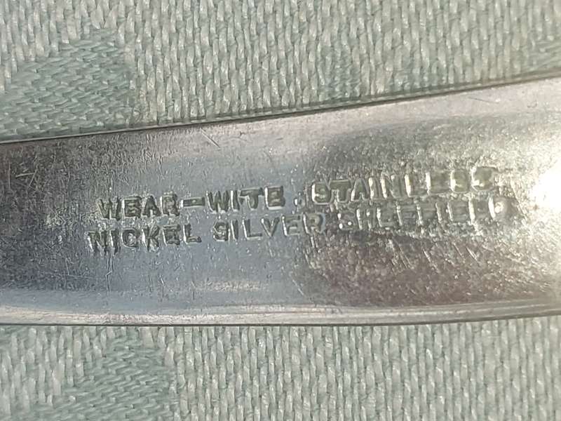 A VINTAGE SET OF NICKEL SILVER SHEFFIELD KNIVES SOLD AS IS