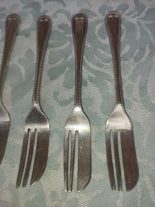 A SET OF 9 EPNS A1 COCKTAIL CUTLERY SET SOLD AS IS