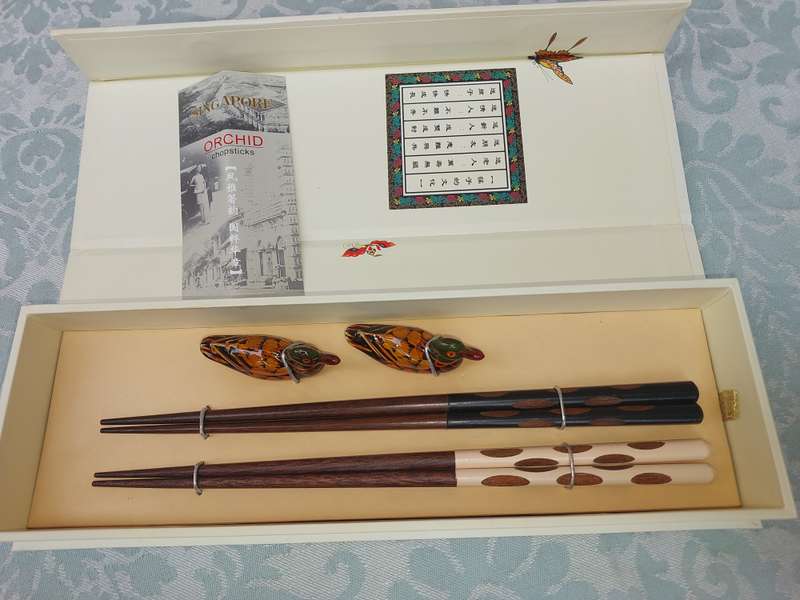 A VINTAGE CHOPSTICK SET DUCK SOLD AS IS