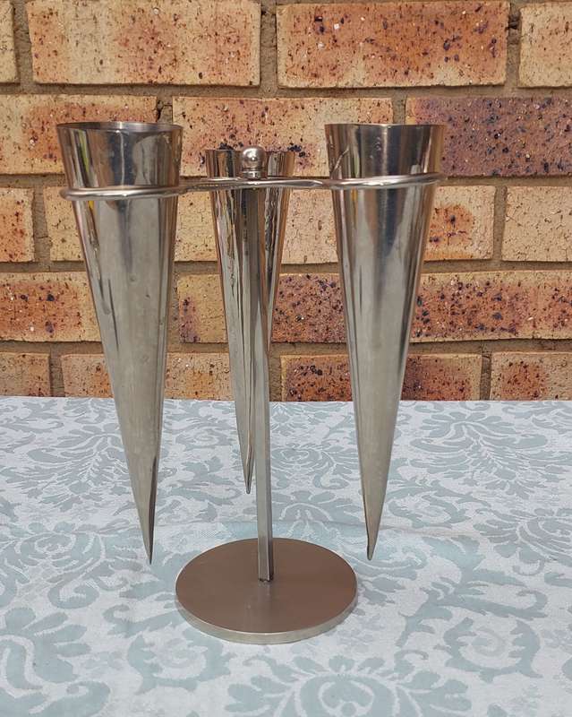 A STAINLESS STEEL ICE CREAM CONE HOLDER SOLD AS IS R200