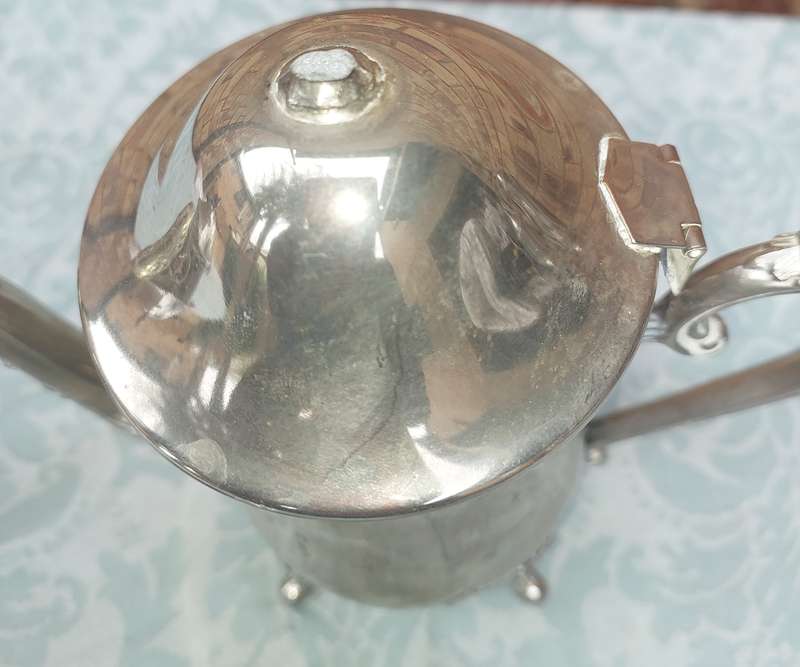 A VINTAGE SILVERPLATE TEAPOT SET WITH A LID HANDLE MISSING SOLD AS IS