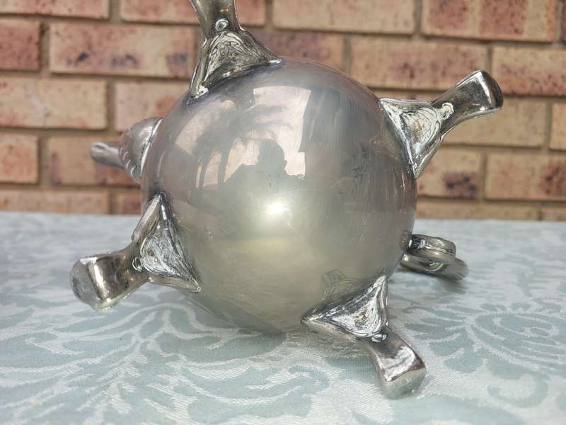 A SILVER PLATED VINTAGE TEAPOT SET SOLD AS IS