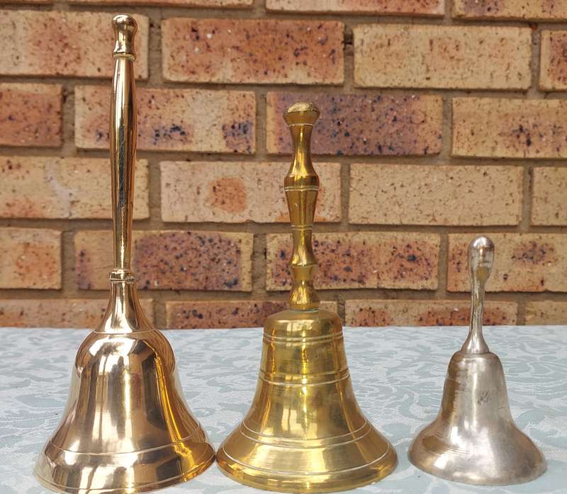A COLLECTION OF BELLS SOLD AS IS