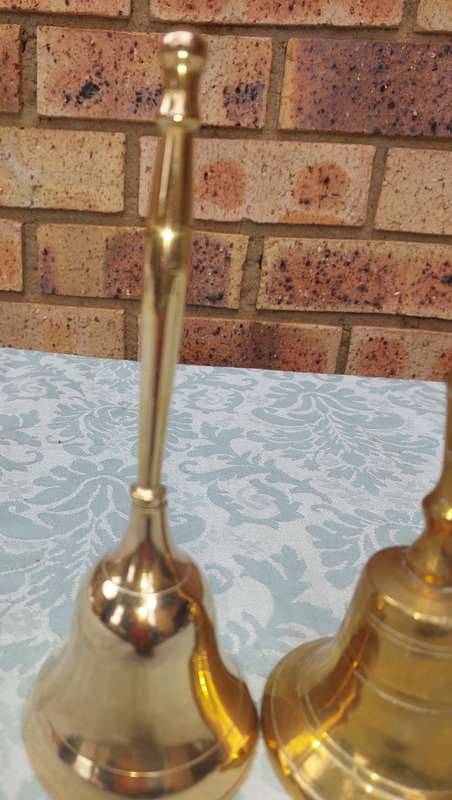 A COLLECTION OF BELLS SOLD AS IS